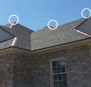 Air terminal lightning rods on a home